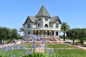 Luxurious victorian architecture home with purple flowers at a winery in Livermore, California